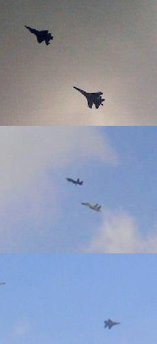 資料圖：AMF五代戰(zhàn)機(jī)在殲-11BS戰(zhàn)斗機(jī)的伴隨下進(jìn)行通場(chǎng)飛行。